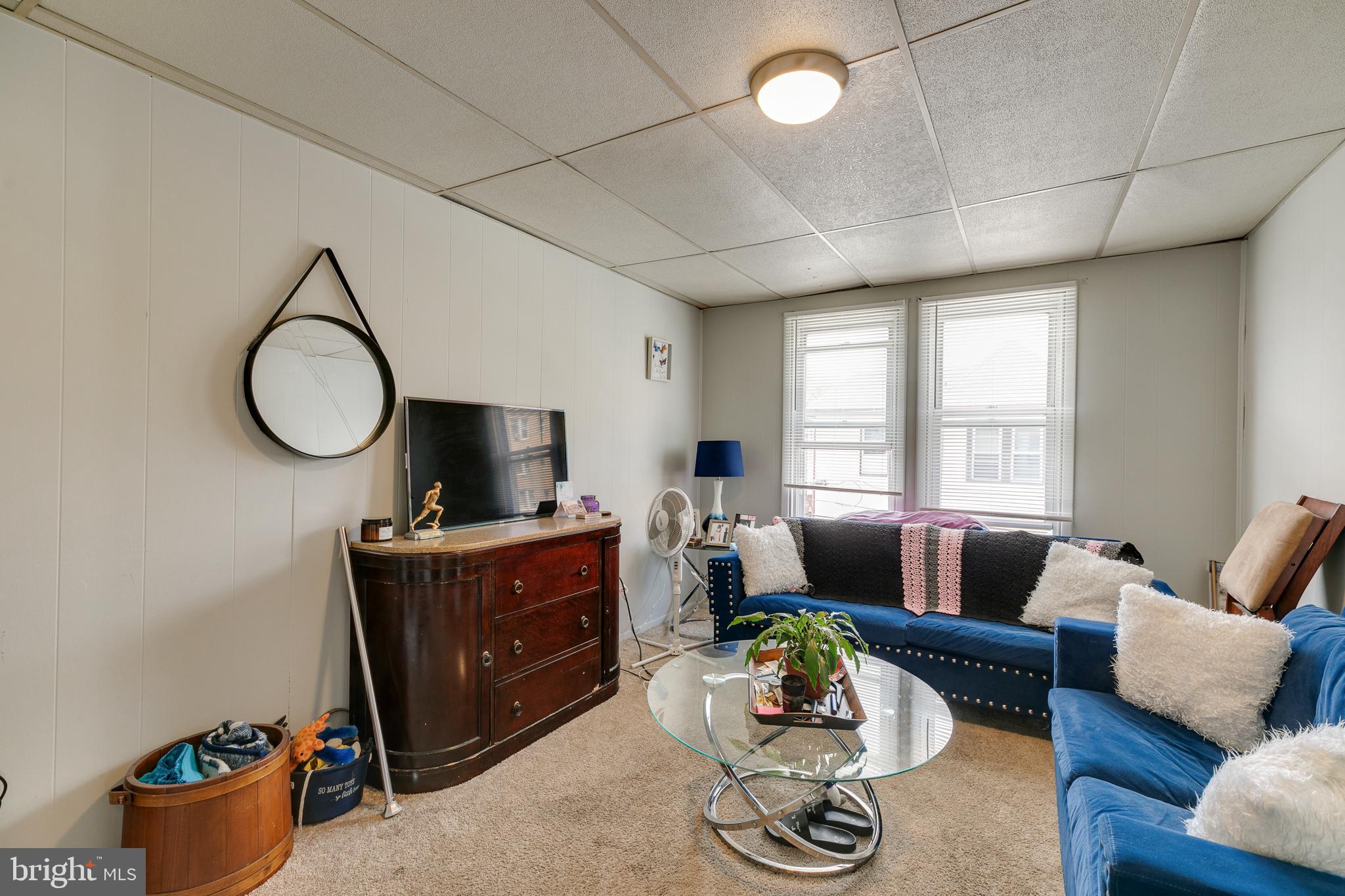 242 Kingston Road Upper Darby, PA 19082 - Photo 14 of 27 a living room with furniture and a flat screen tv