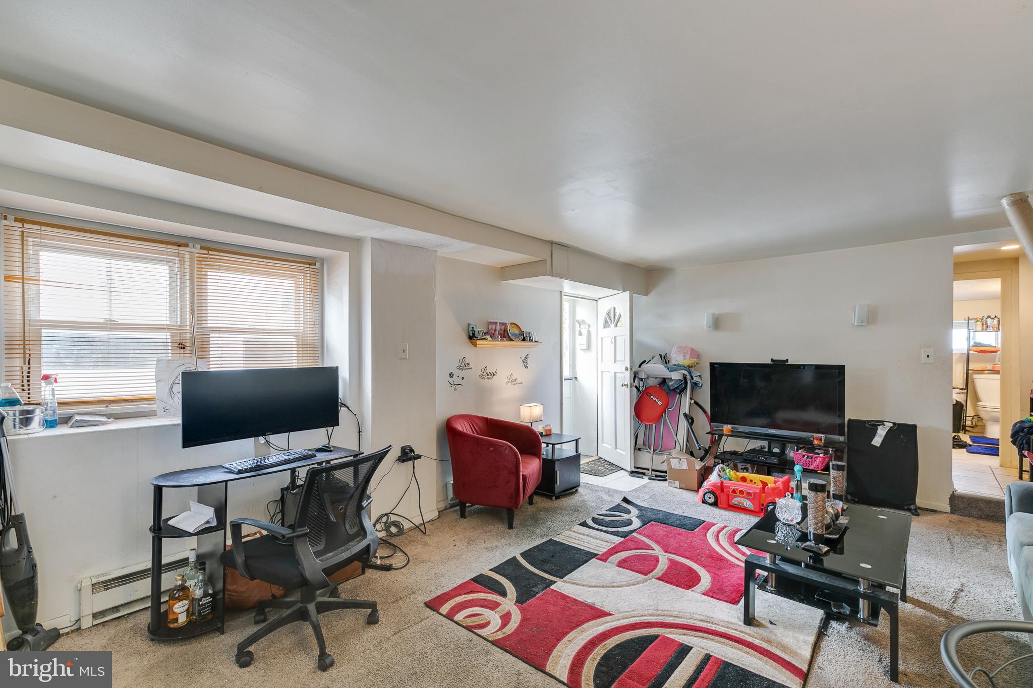 242 Kingston Road Upper Darby, PA 19082 - Photo 20 of 27 a living room with furniture and a flat screen tv
