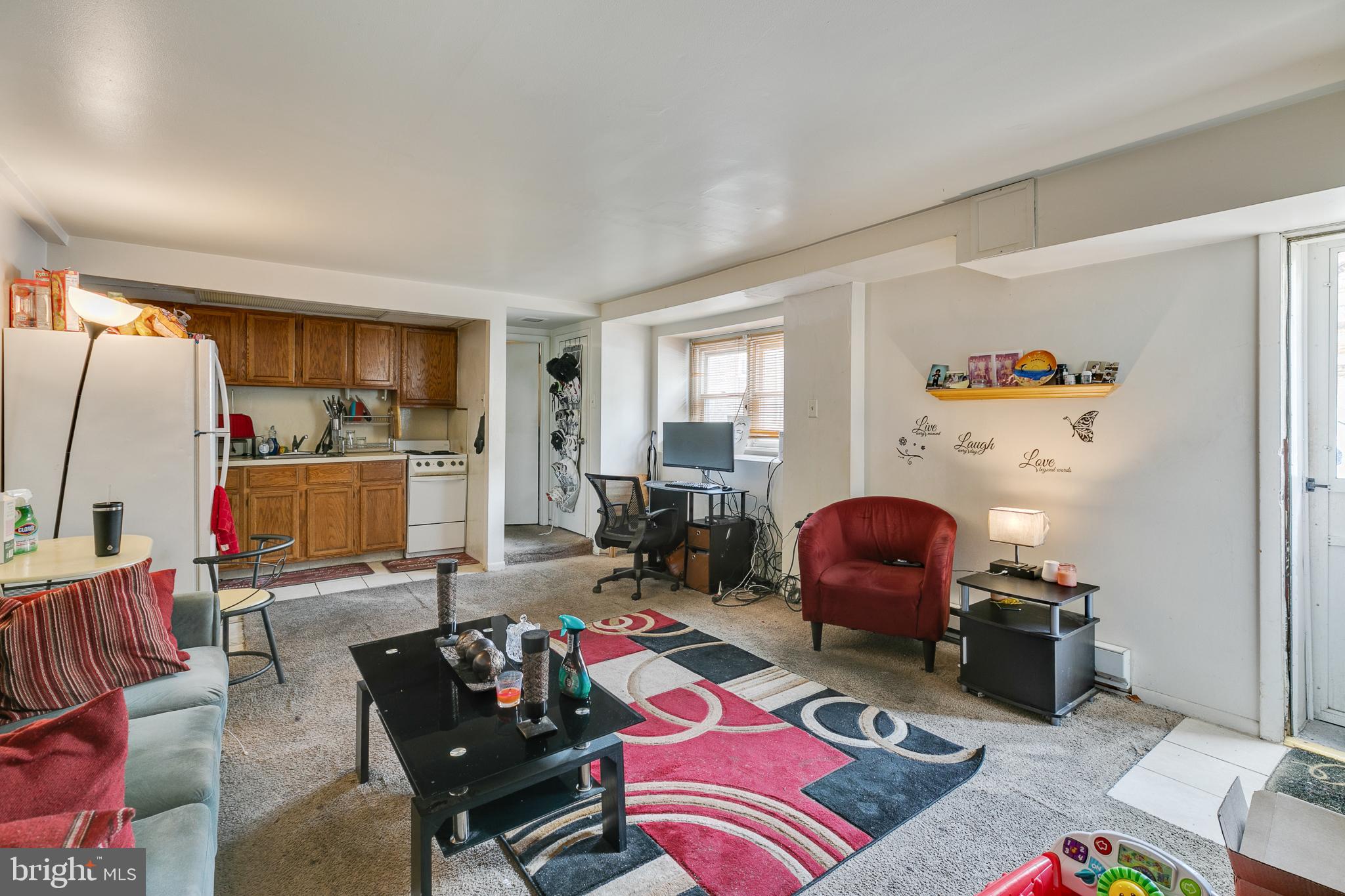 242 Kingston Road Upper Darby, PA 19082 - Photo 22 of 27 a living room with furniture and a flat screen tv