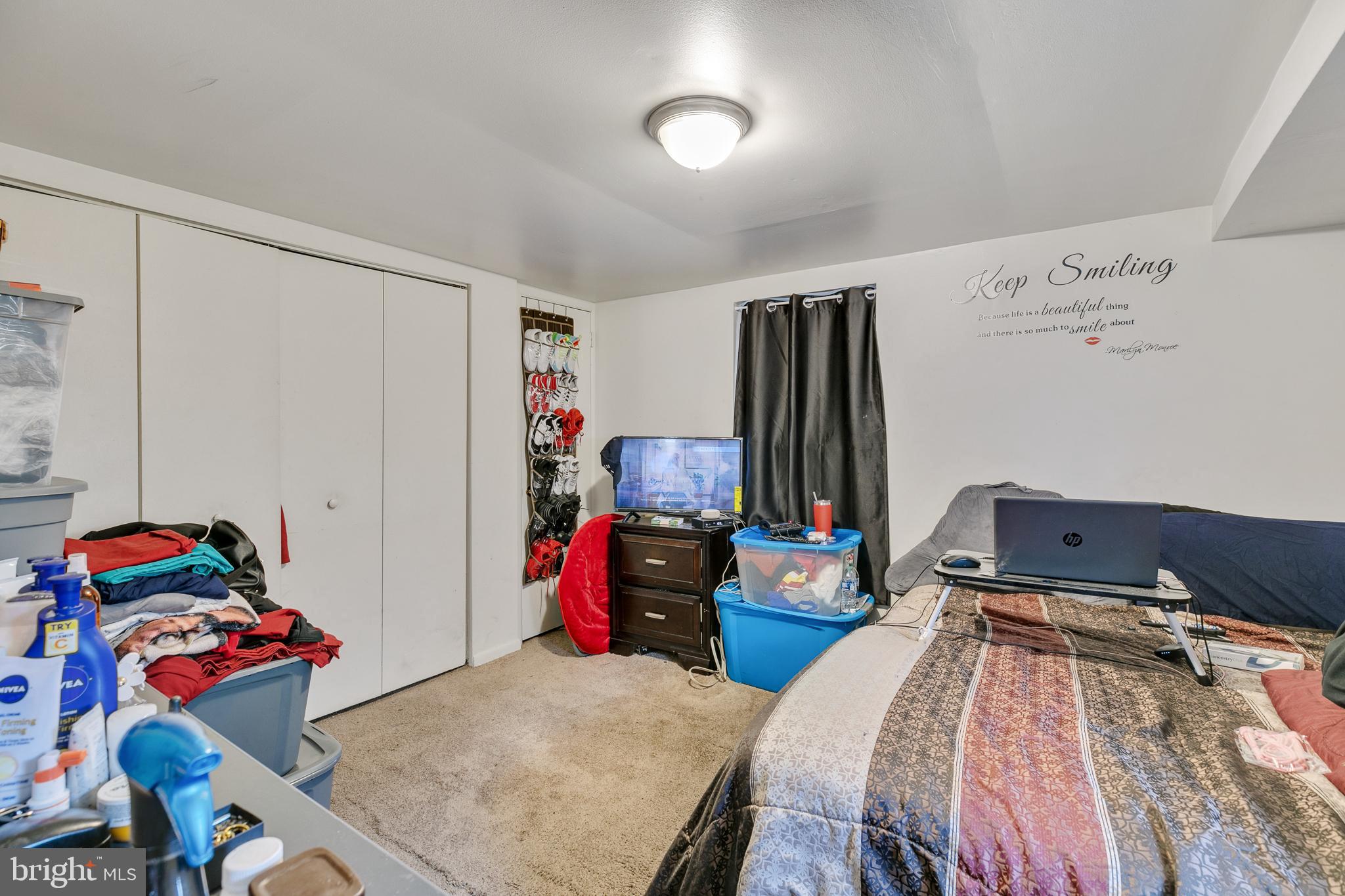 242 Kingston Road Upper Darby, PA 19082 - Photo 24 of 27 a bedroom with a bed and wooden floor