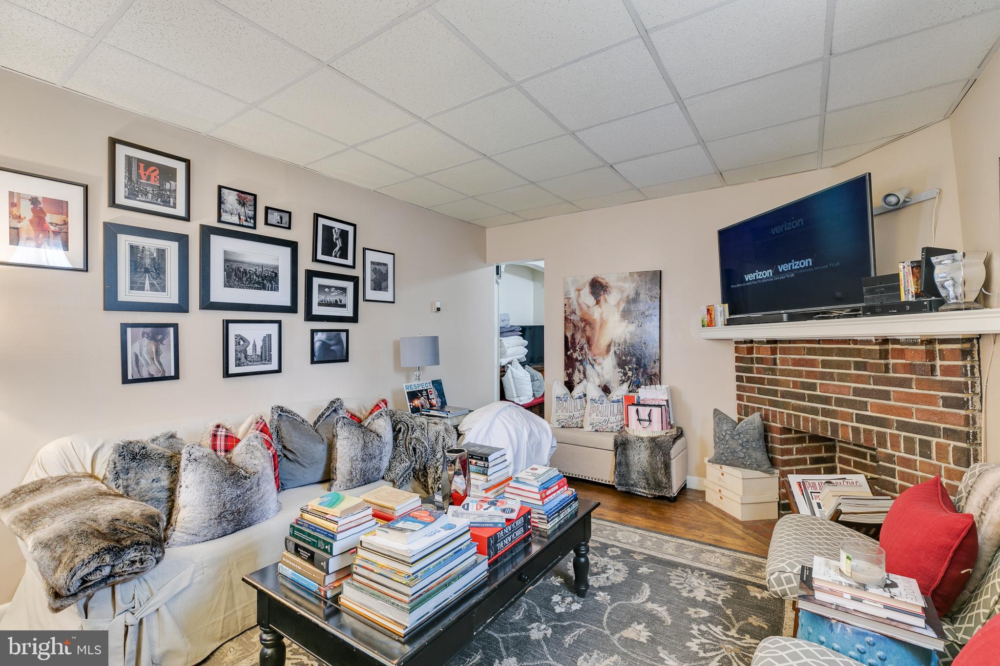 242 Kingston Road Upper Darby, PA 19082 - Photo 3 of 27 a bedroom with furniture and a flat screen tv