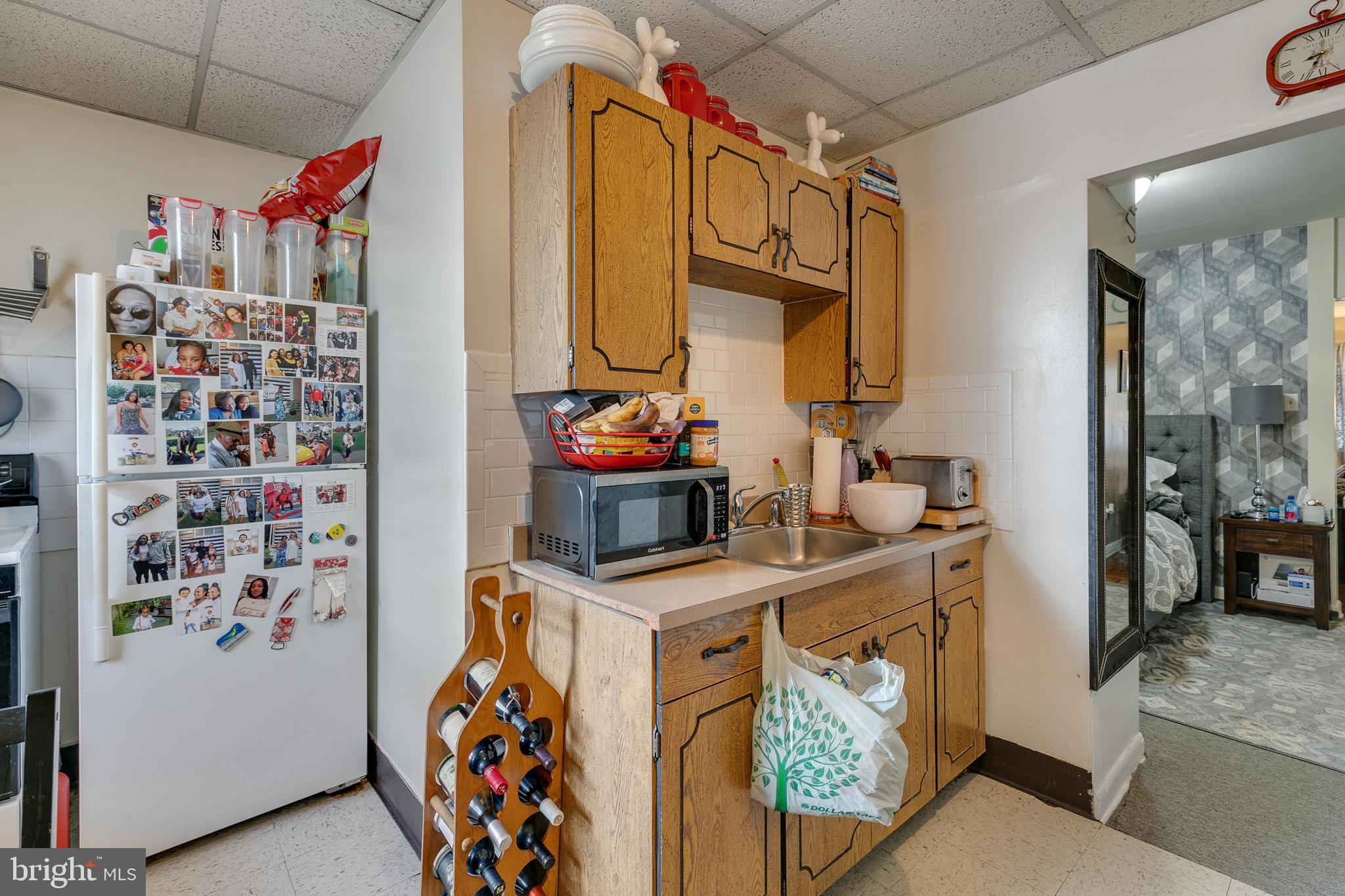 242 Kingston Road Upper Darby, PA 19082 - Photo 9 of 27 a utility room with fridge dryer and washer