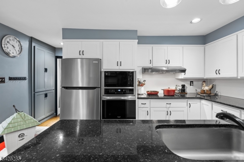 269 Quakertown Road Pittstown, NJ 08867 - Photo 12 of 25 a kitchen with stainless steel appliances a refrigerator sink and cabinets