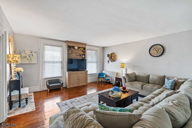 269 Quakertown Road Pittstown, NJ 08867 - Photo 16 of 25 a living room with furniture and a flat screen tv