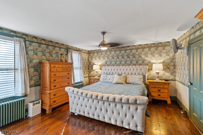 269 Quakertown Road Pittstown, NJ 08867 - Photo 20 of 25 a bedroom with a bed and wooden floor