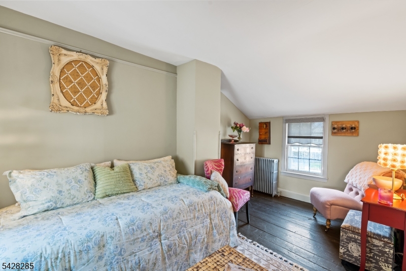 269 Quakertown Road Pittstown, NJ 08867 - Photo 23 of 25 a bedroom with a bed and wooden floor