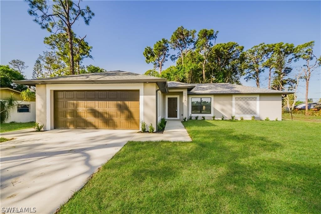 front view of a house with a yard