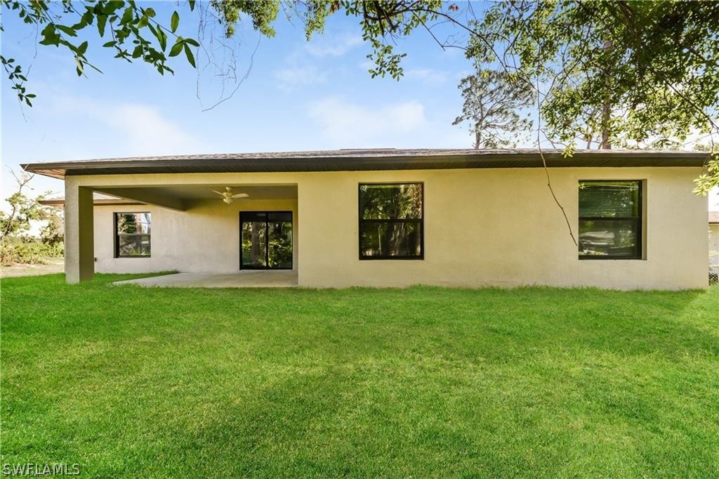 8422 Cardinal Road Fort Myers, FL 33967 - Photo 15 of 15 a view of a house with a yard