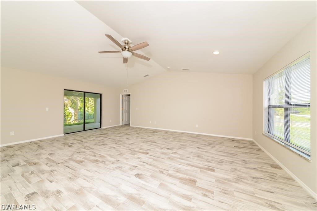 8422 Cardinal Road Fort Myers, FL 33967 - Photo 2 of 15 an empty room with windows and closet