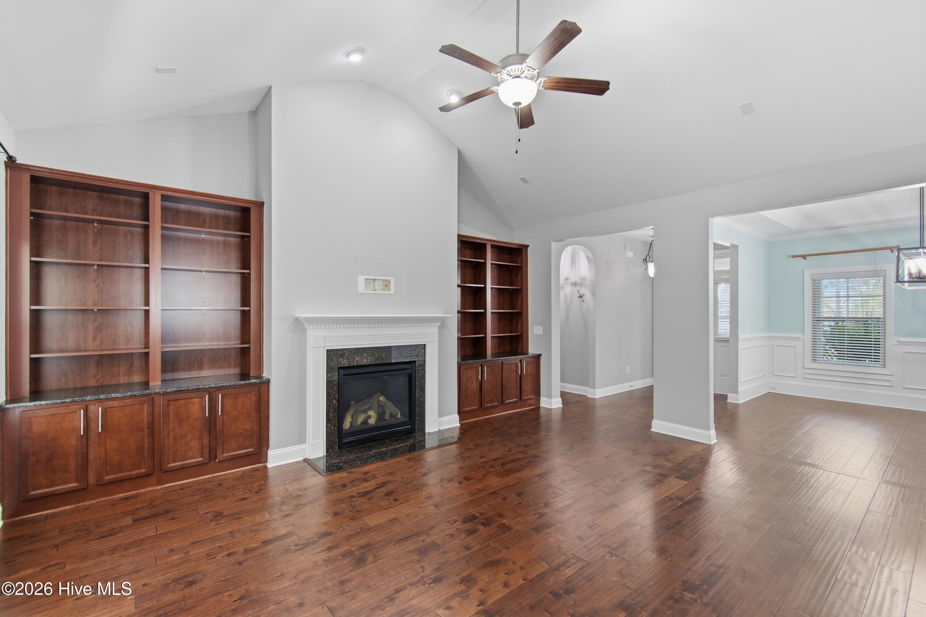 1678 Old Salt Run Southwest Shallotte, NC 28470 - Photo 13 of 73 Stained wood built-ins and fireplace.