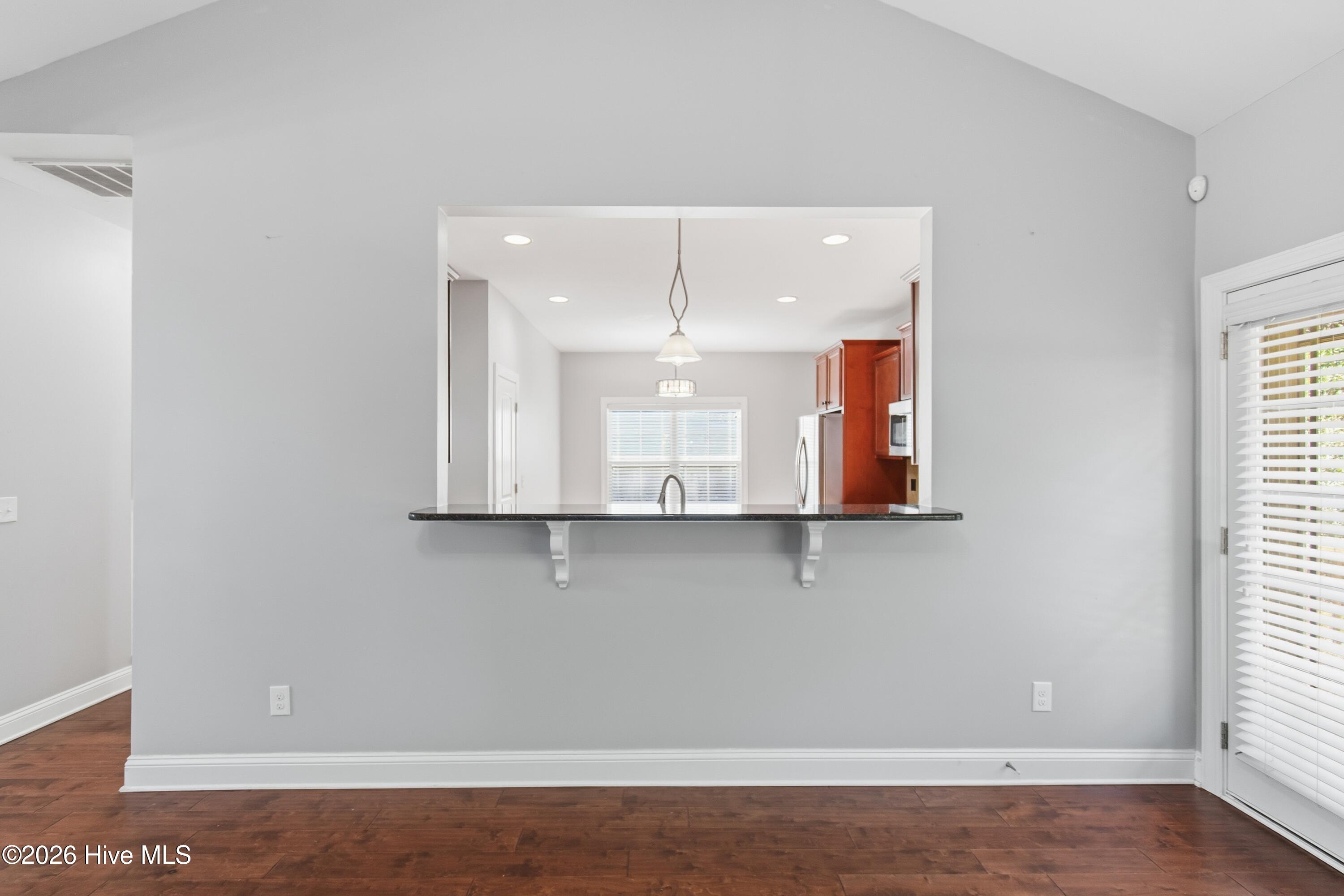 1678 Old Salt Run Southwest Shallotte, NC 28470 - Photo 15 of 73 Window to kitchen with granite countertop.