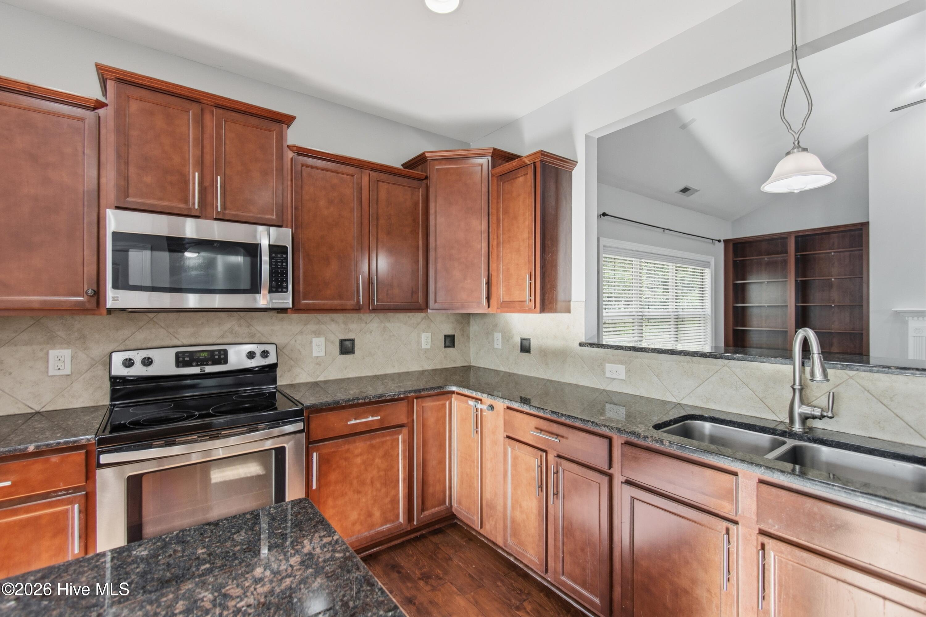 1678 Old Salt Run Southwest Shallotte, NC 28470 - Photo 18 of 73 Pendant light over deep sink. Beautiful backsplash.