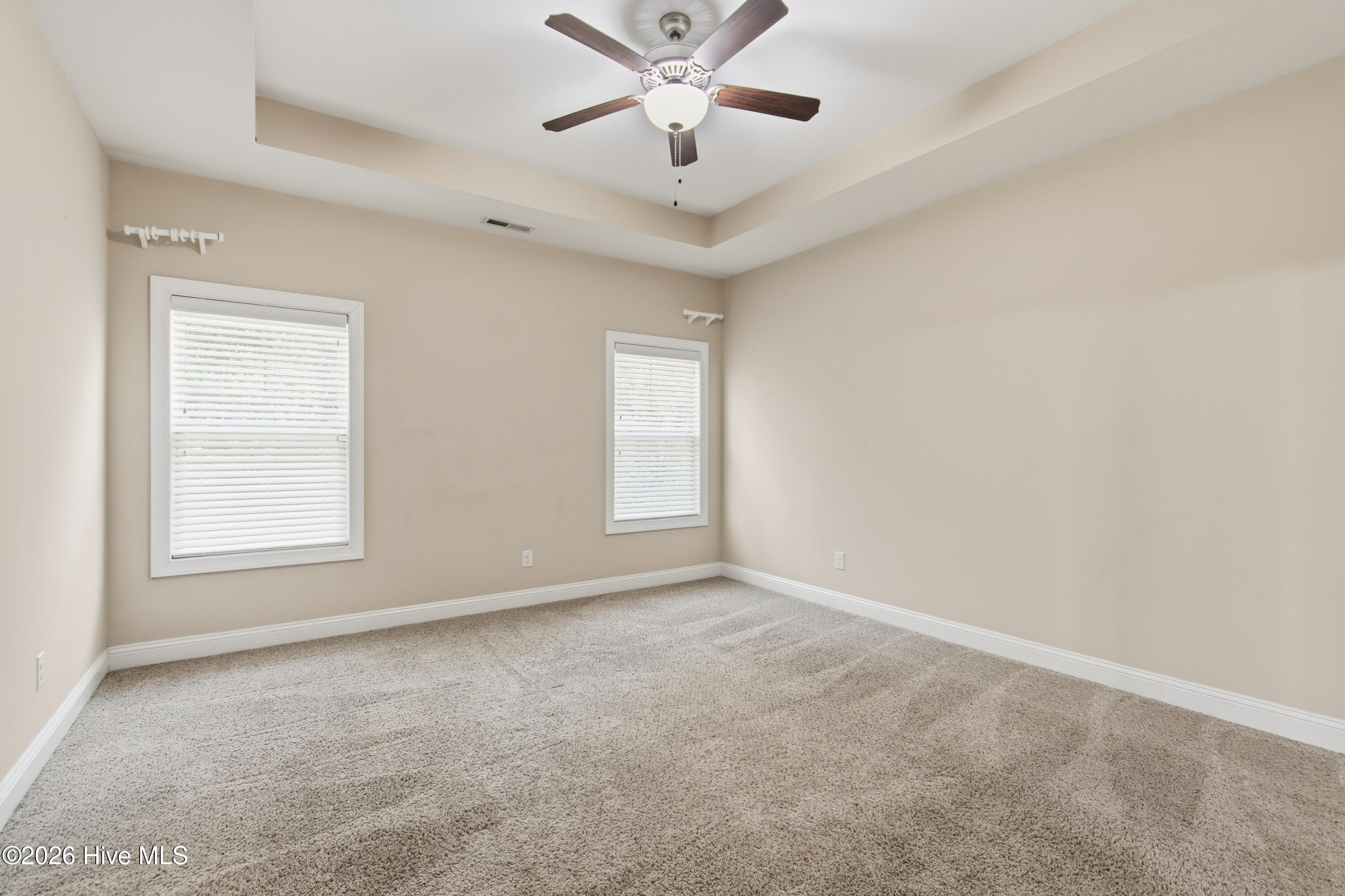 1678 Old Salt Run Southwest Shallotte, NC 28470 - Photo 20 of 73 Primary bedroom located off of living room. Tray ceiling.