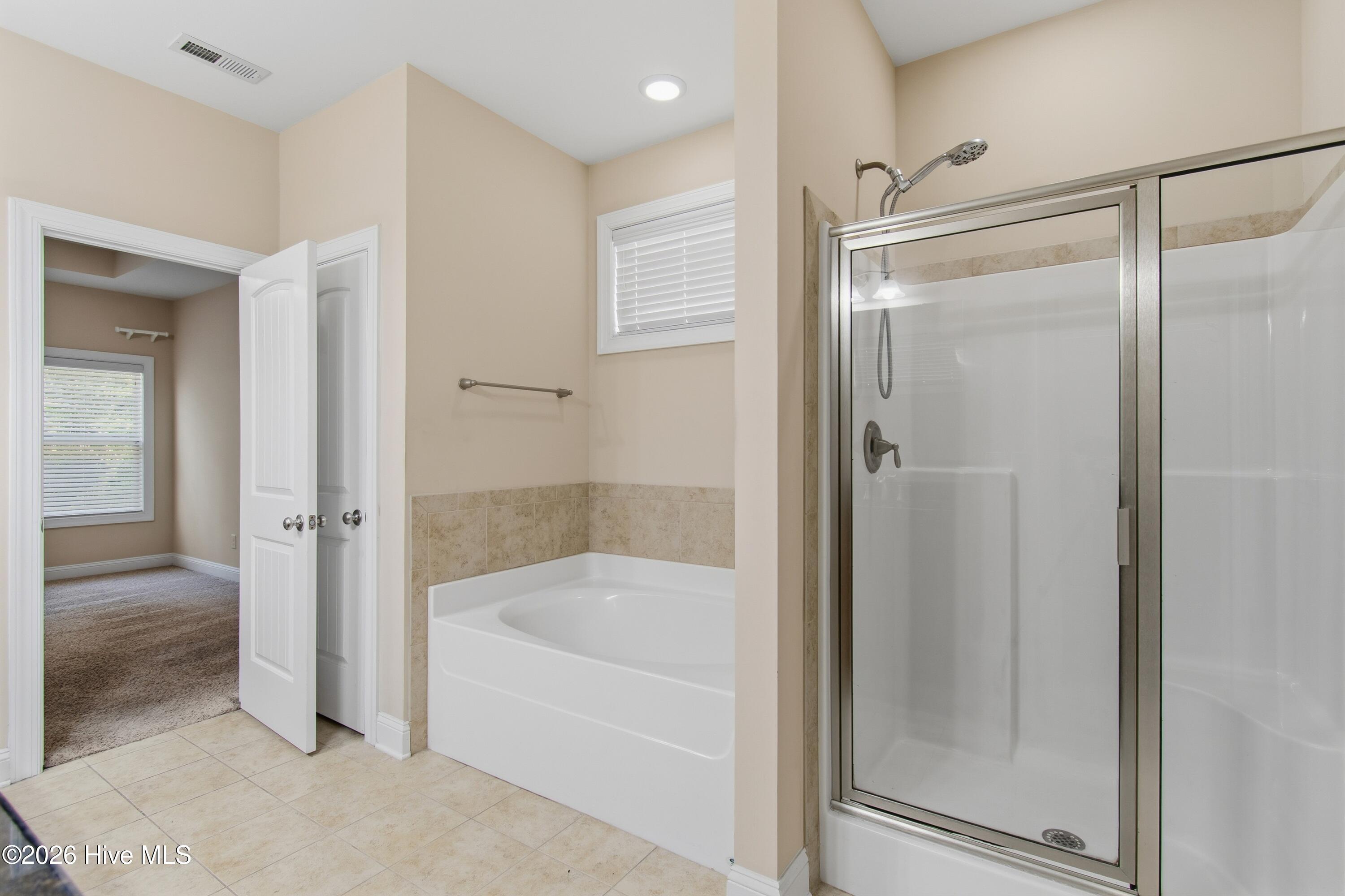 1678 Old Salt Run Southwest Shallotte, NC 28470 - Photo 24 of 73 Tub and shower in primary bath.