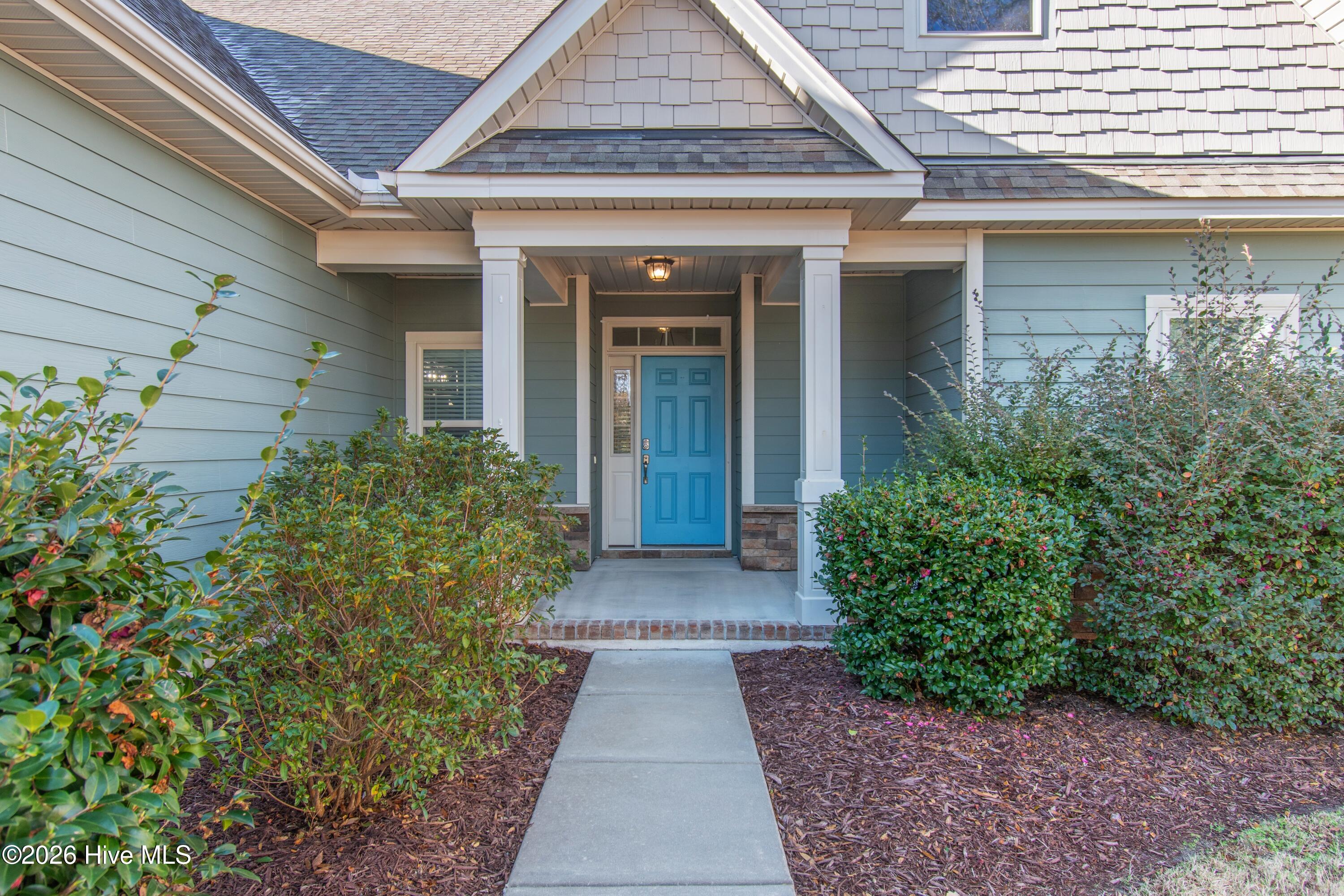1678 Old Salt Run Southwest Shallotte, NC 28470 - Photo 7 of 73 Welcoming front porch with beautiful mature landscaping.