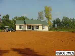 349 Sutton Spring Road, Unit 1 York, SC 29745 - Photo 1 of 8 a house with trees in front of it