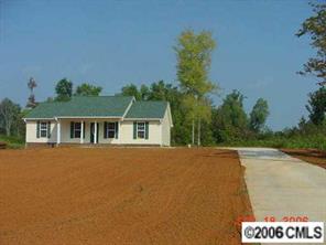 349 Sutton Spring Road, Unit 1 York, SC 29745 - Photo 3 of 8 a front view of a house with a yard and trees
