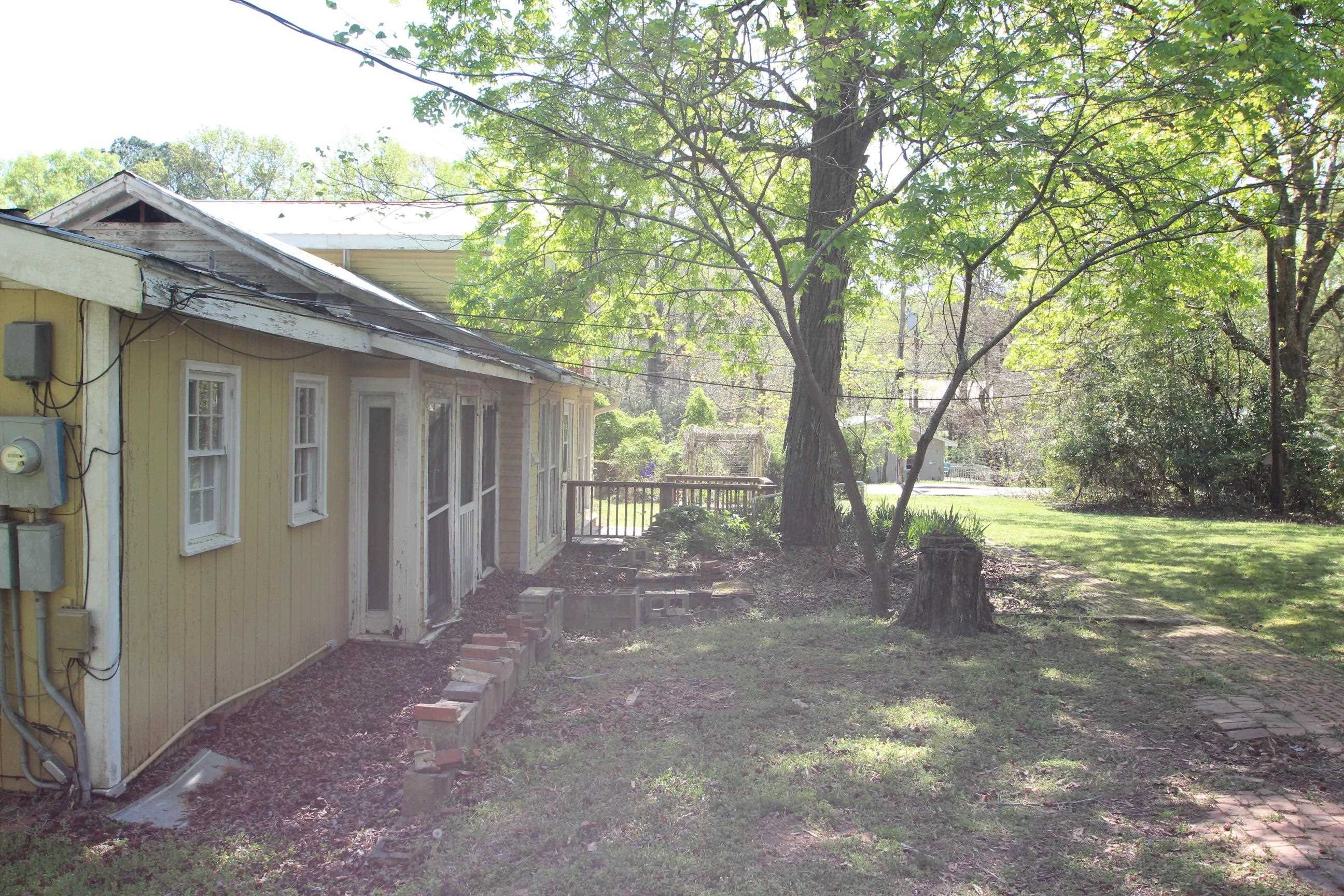 116 Pine Street Carrboro, NC 27510 - Photo 12 of 66 a view of a yard with a tree