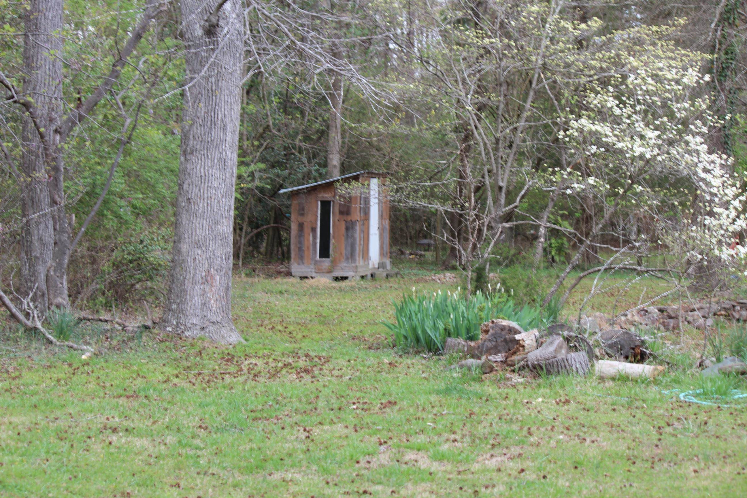 116 Pine Street Carrboro, NC 27510 - Photo 14 of 66 a view of a house with a backyard