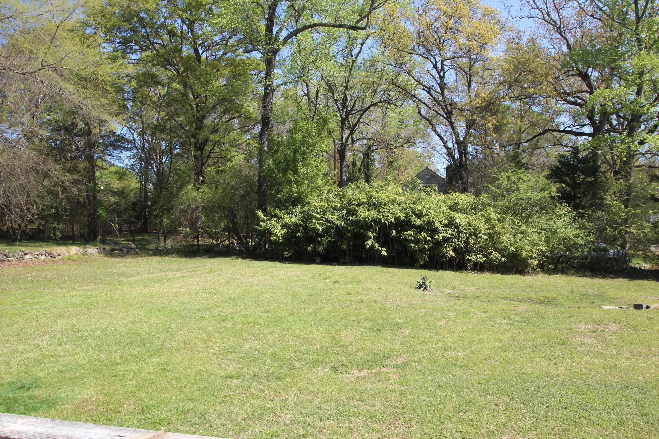 116 Pine Street Carrboro, NC 27510 - Photo 15 of 66 a view of a yard with a tree