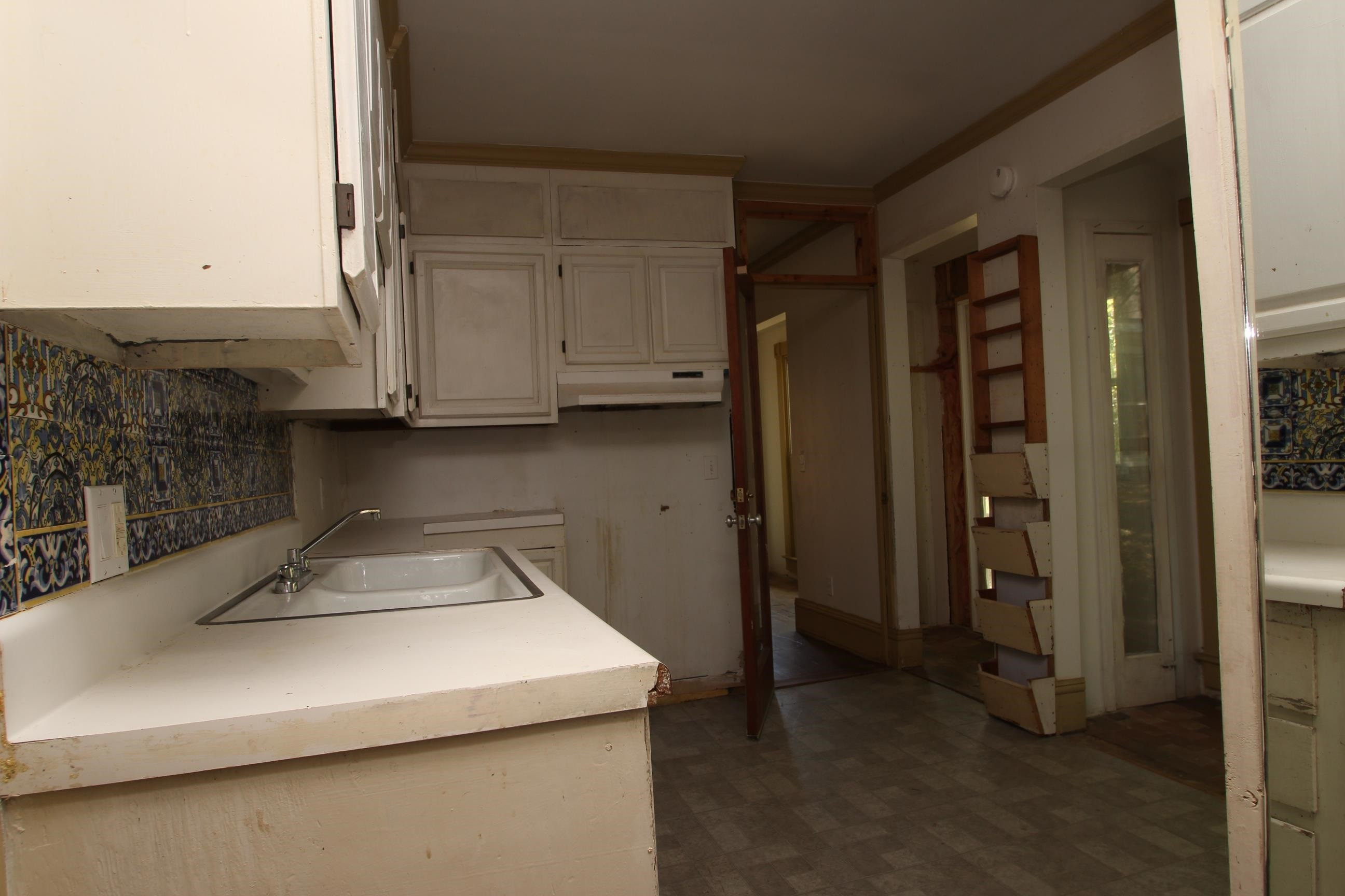 116 Pine Street Carrboro, NC 27510 - Photo 30 of 66 a kitchen with a sink and cabinets