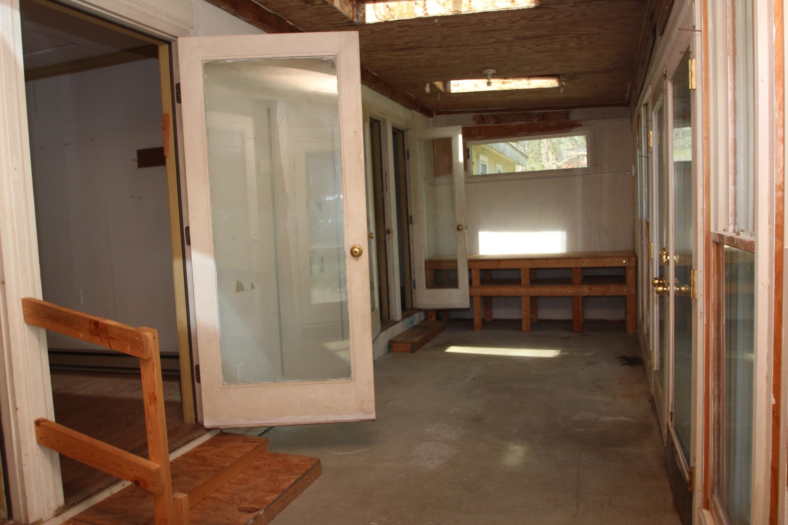 116 Pine Street Carrboro, NC 27510 - Photo 35 of 66 a view of room with door and windows