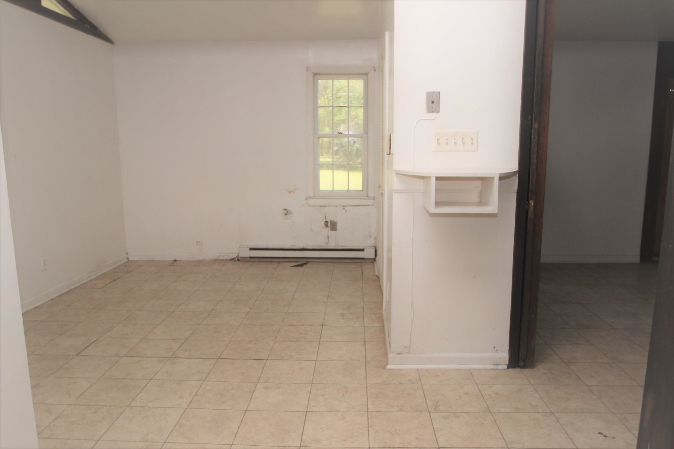 116 Pine Street Carrboro, NC 27510 - Photo 46 of 66 a view of an empty room with a window