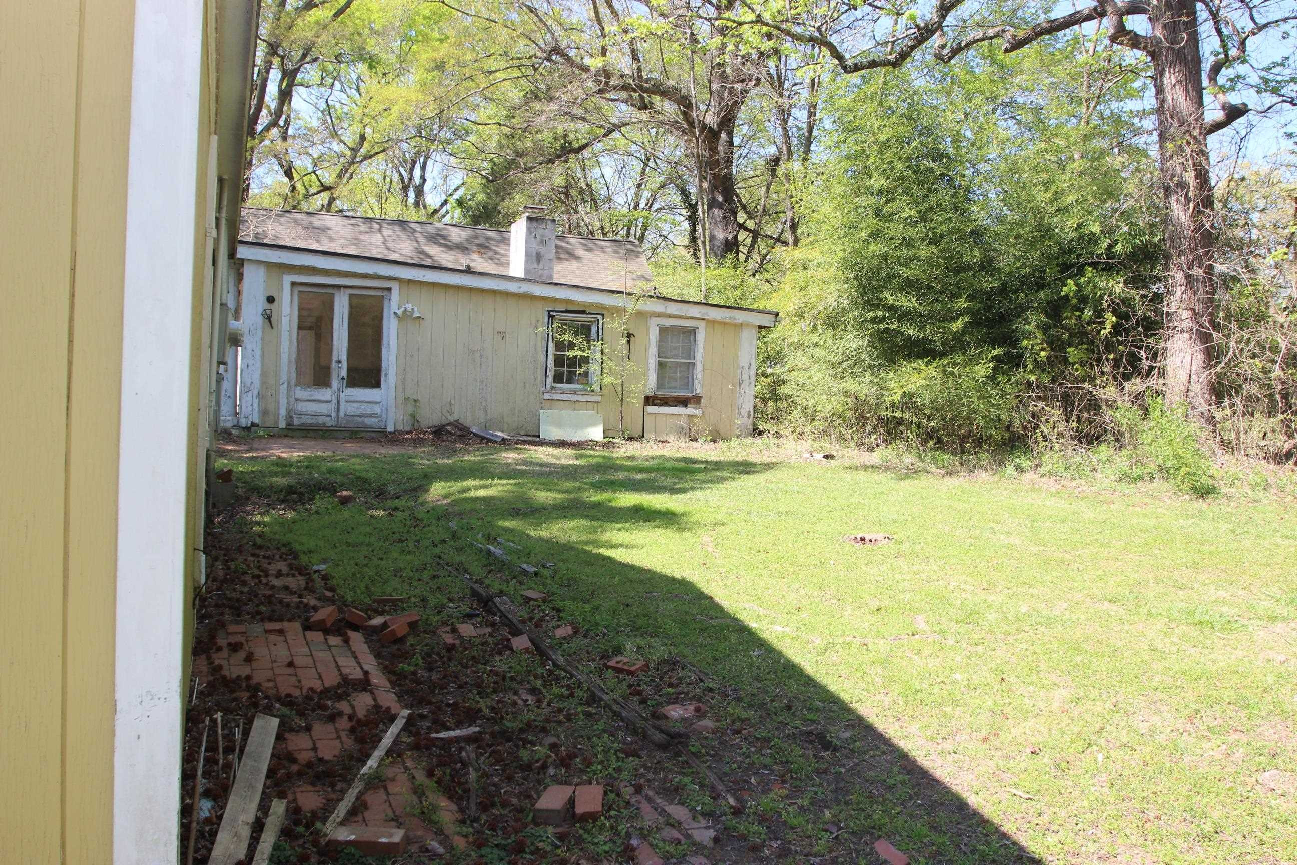 116 Pine Street Carrboro, NC 27510 - Photo 59 of 66 a view of a house with a yard and sitting area