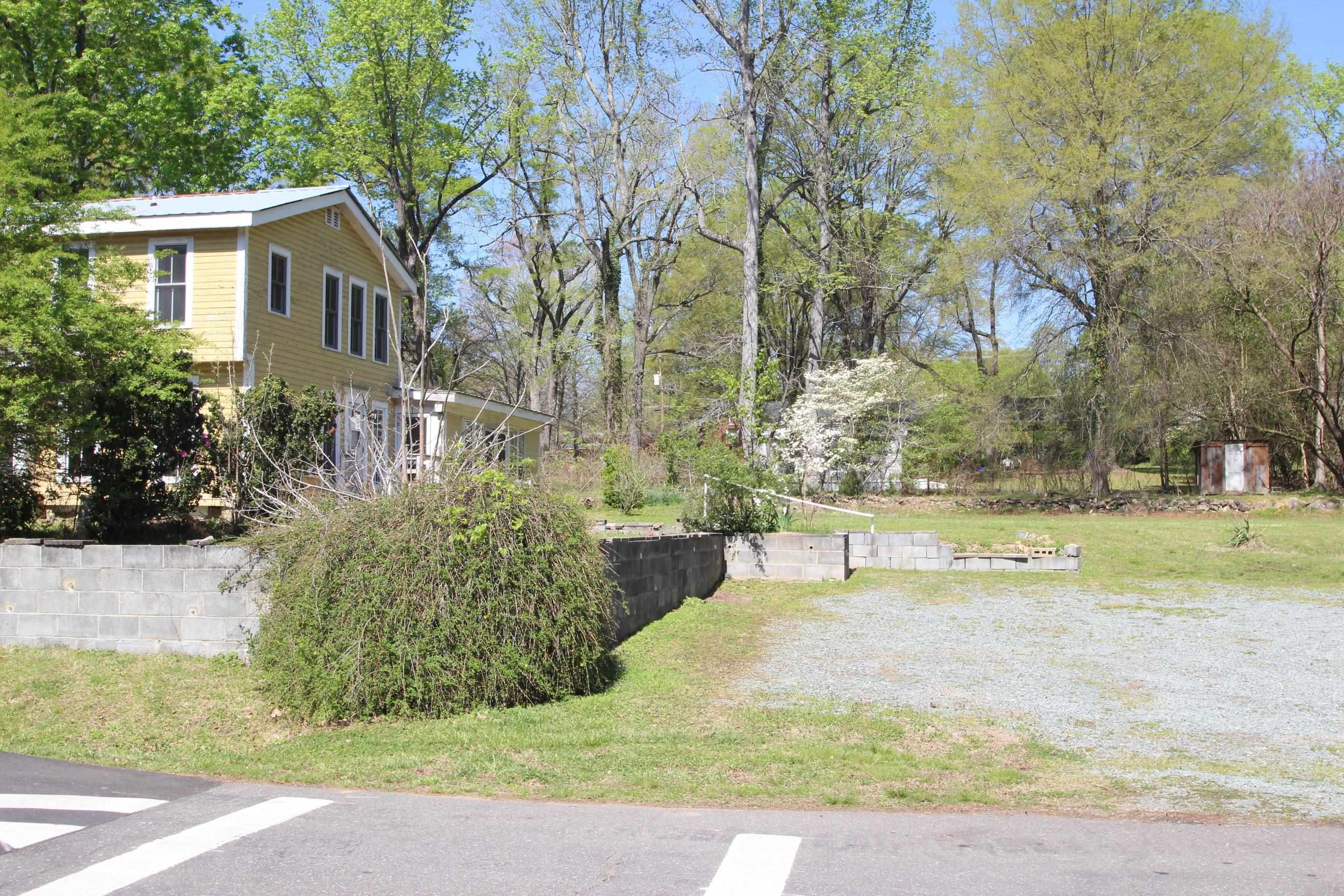 116 Pine Street Carrboro, NC 27510 - Photo 10 of 66 a view of a yard with plants and trees