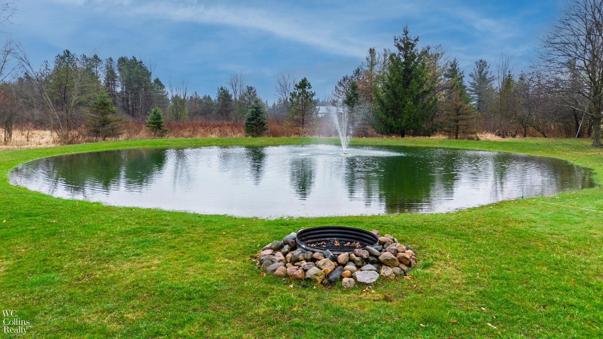 7465 Frith Road St. Clair, MI 48079 - Photo 9 of 38 Pond with Fire Pit