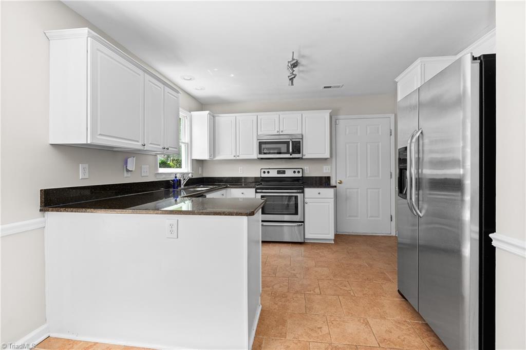 2230 Riley Forest Drive Winston-Salem, NC 27127 - Photo 11 of 25 Nice bright kitchen