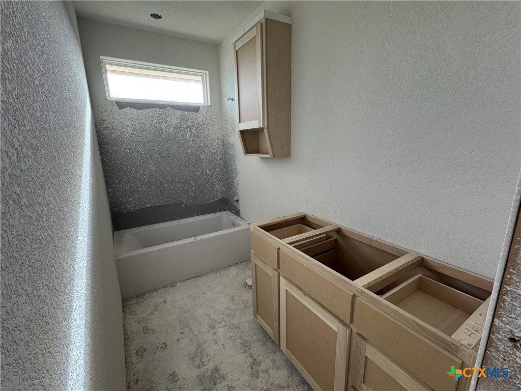 1331 Rylee Lane Salado, TX 76571 - Photo 15 of 18 a bathroom with a tub and sink