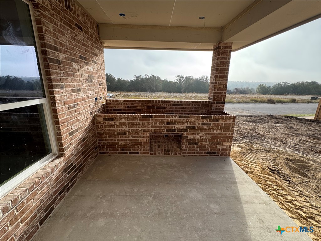 1331 Rylee Lane Salado, TX 76571 - Photo 5 of 18 a balcony with outdoor seating and water view