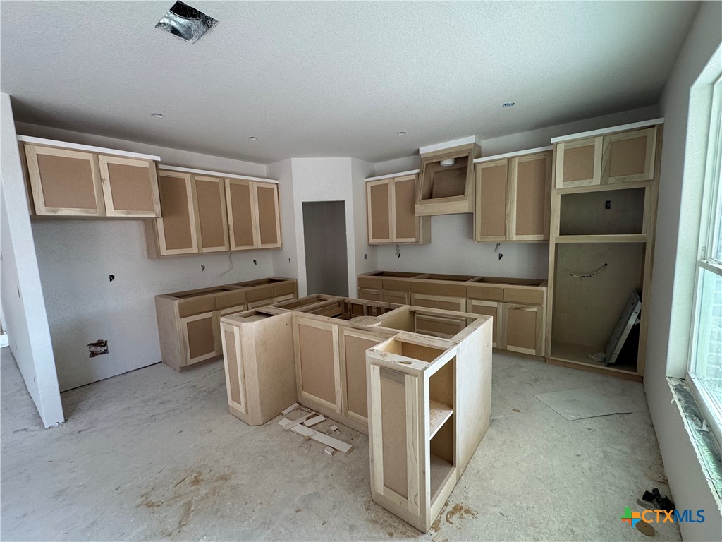 1331 Rylee Lane Salado, TX 76571 - Photo 9 of 18 a kitchen with a stove and a refrigerator