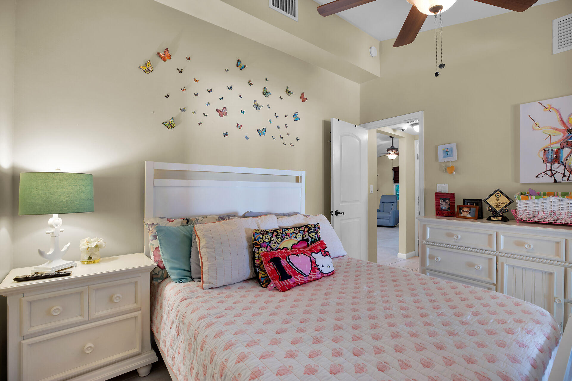 1041 Gibraltar Road Key Largo, FL 33037 - Photo 12 of 36 a bedroom with a bed and a chandelier