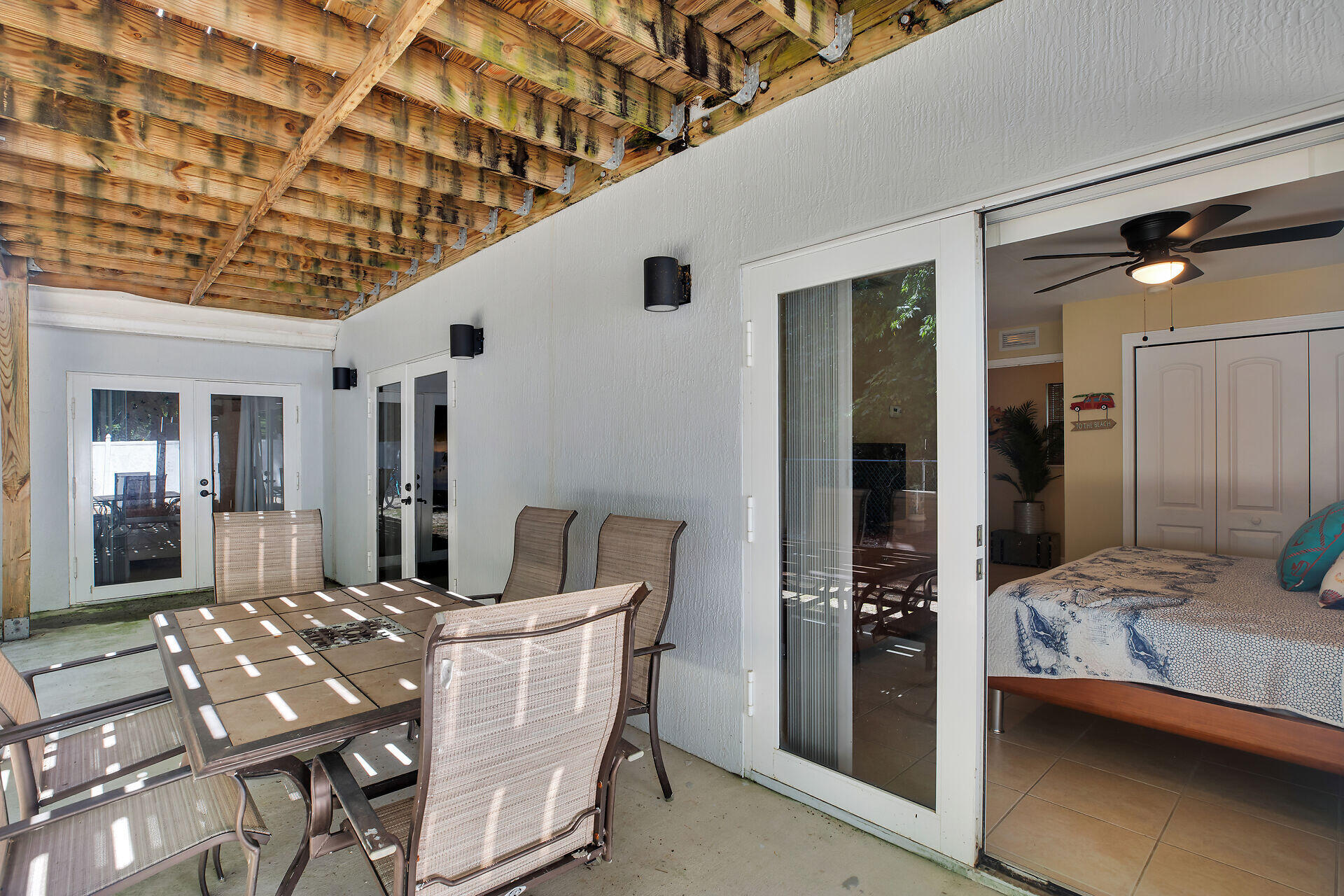 1041 Gibraltar Road Key Largo, FL 33037 - Photo 18 of 36 a dining room with furniture and a chandelier