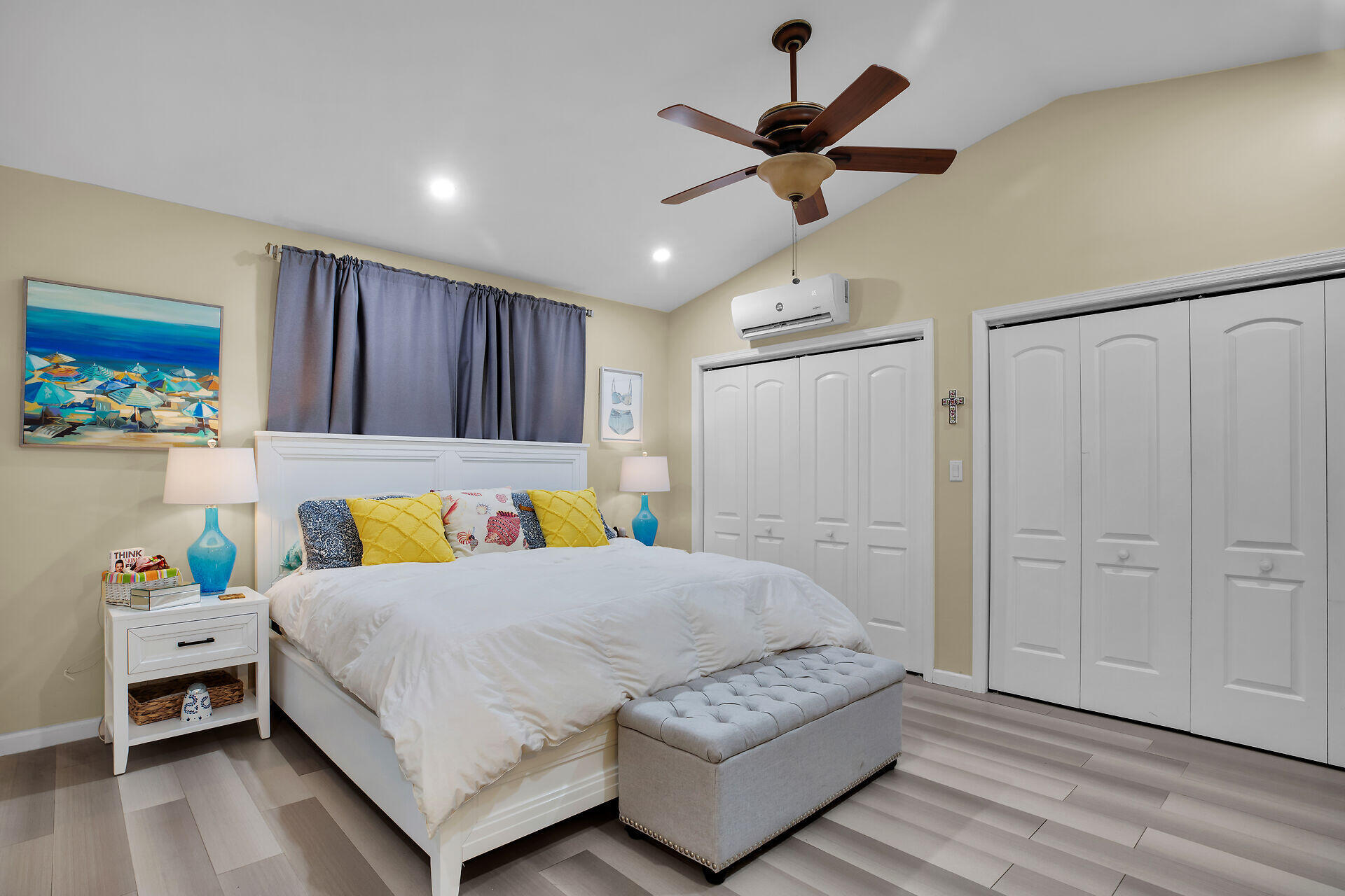 1041 Gibraltar Road Key Largo, FL 33037 - Photo 23 of 36 a bedroom with a bed a dresser and a chandelier