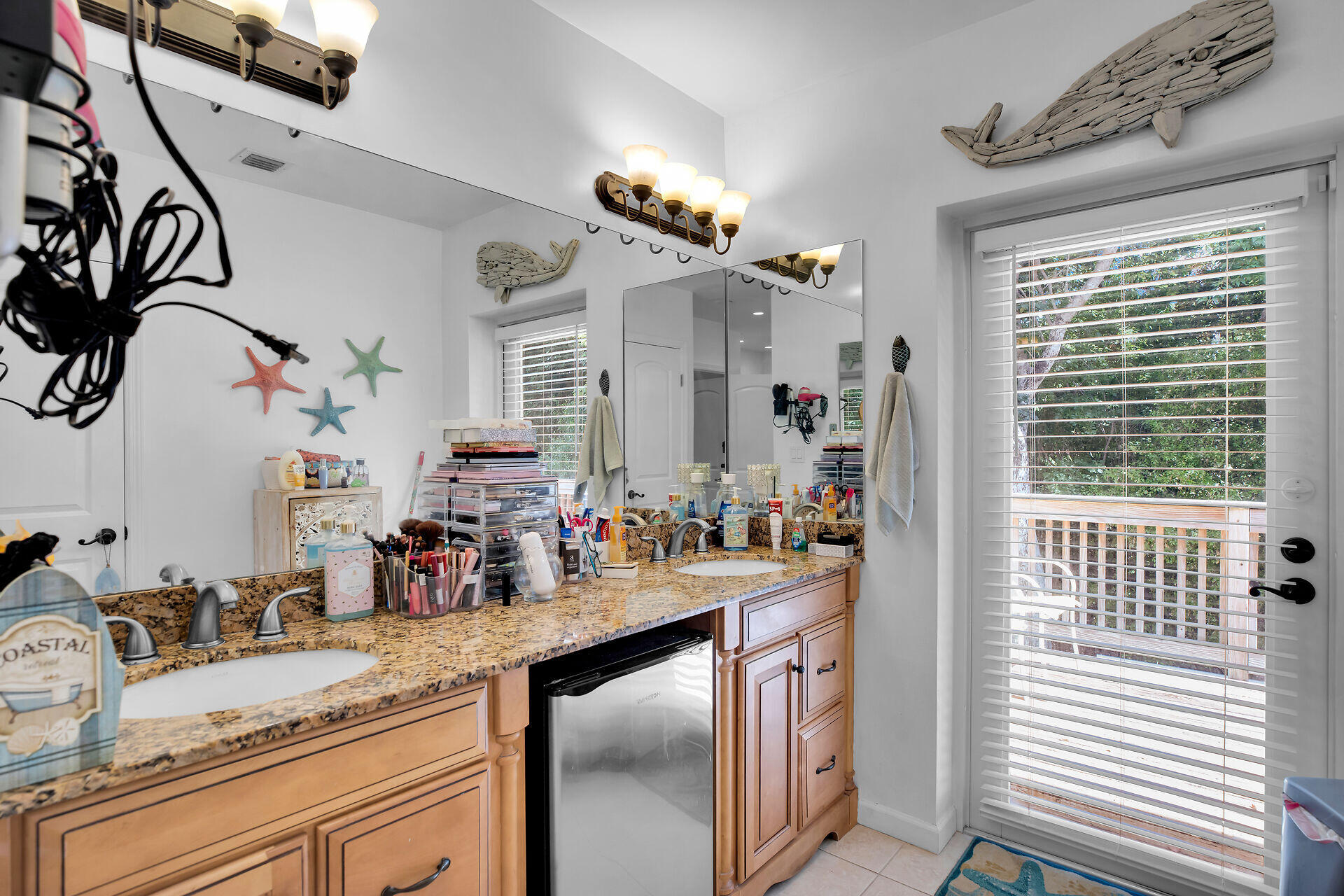 1041 Gibraltar Road Key Largo, FL 33037 - Photo 29 of 36 a bathroom with a sink double vanity and a mirror