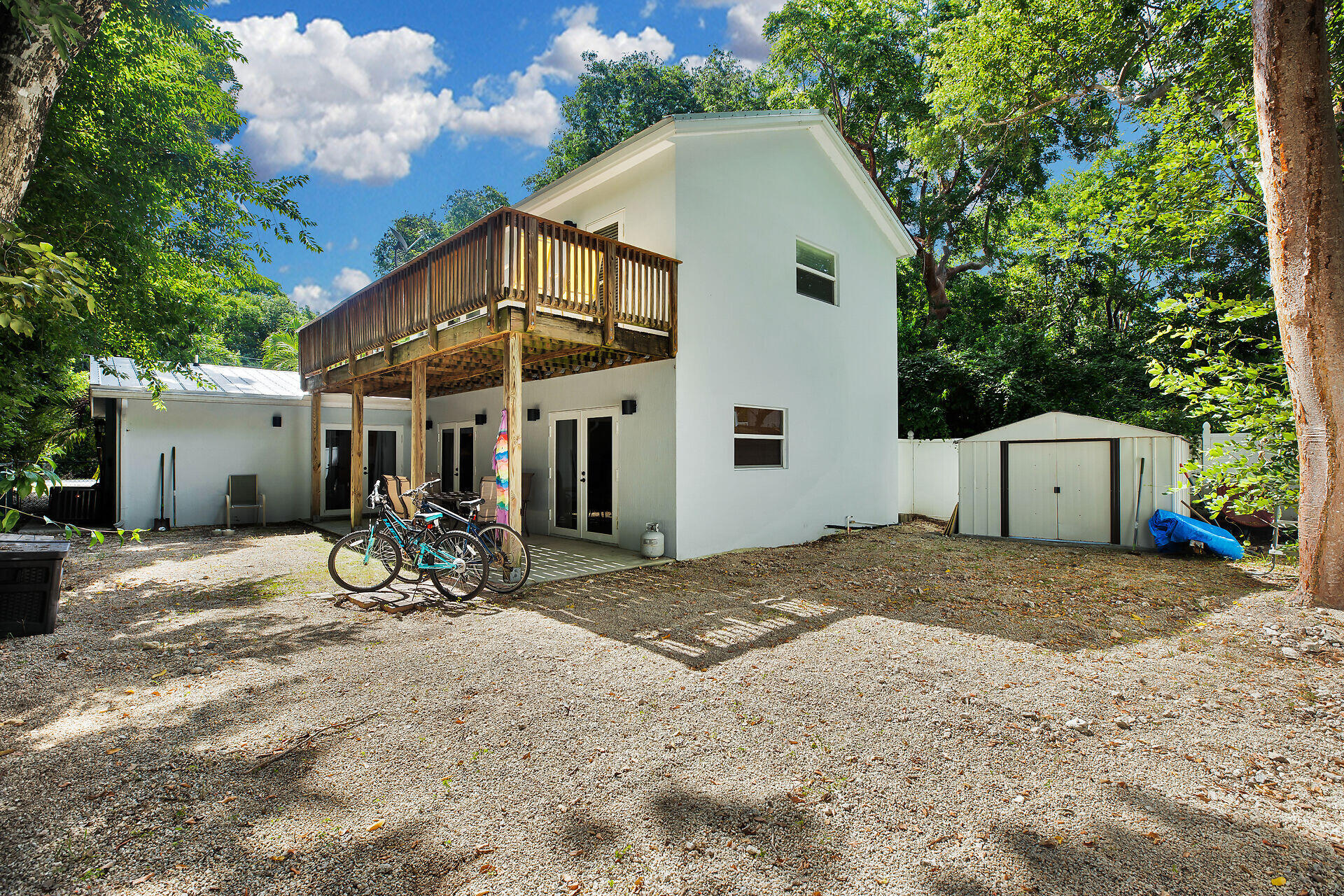 1041 Gibraltar Road Key Largo, FL 33037 - Photo 32 of 36 a view of a wooden house with a patio