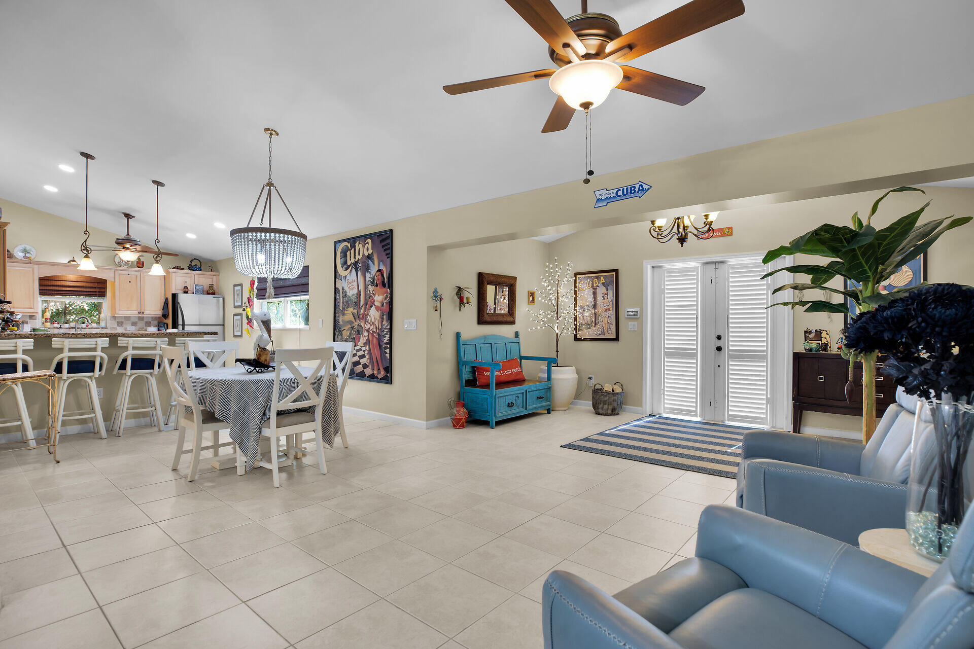 1041 Gibraltar Road Key Largo, FL 33037 - Photo 6 of 36 a living room with furniture kitchen view and a chandelier