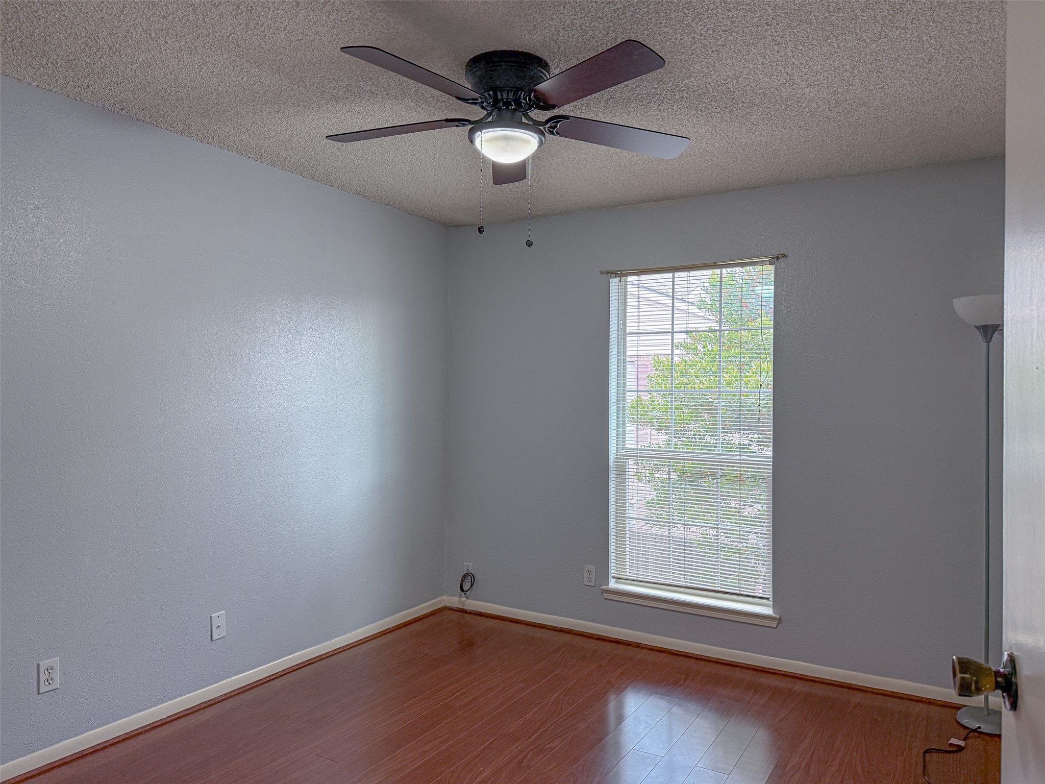 3100 Jeanetta Street, Unit 1104 Houston, TX 77063 - Photo 14 of 19 an empty room with a window and a fan
