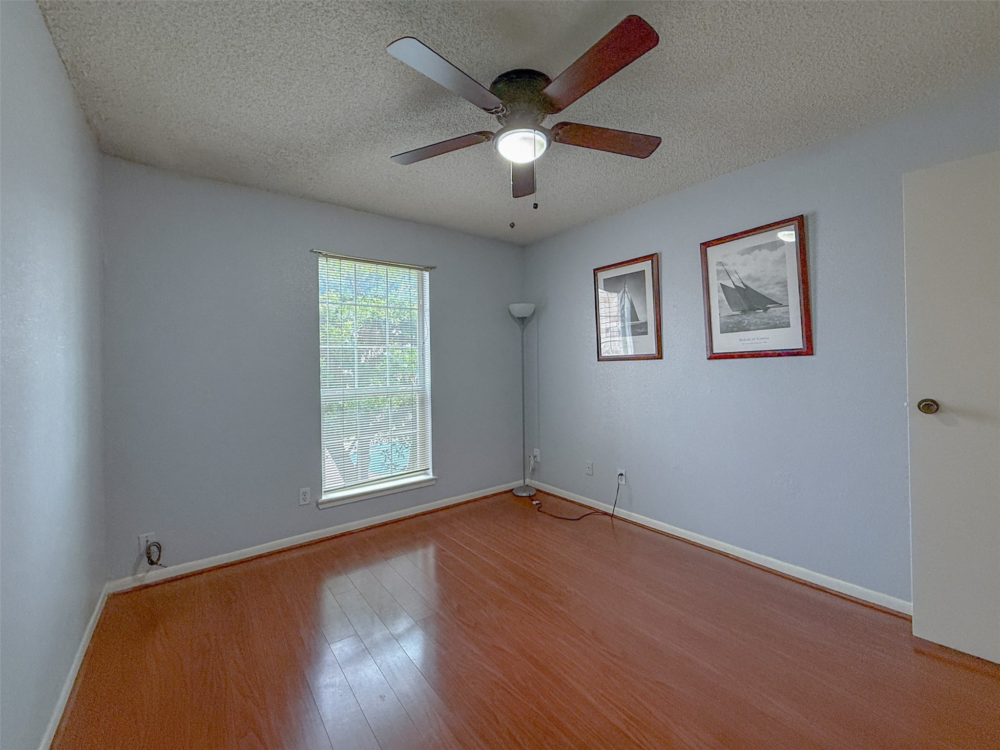 3100 Jeanetta Street, Unit 1104 Houston, TX 77063 - Photo 15 of 19 a view of an empty room with wooden floor and a window