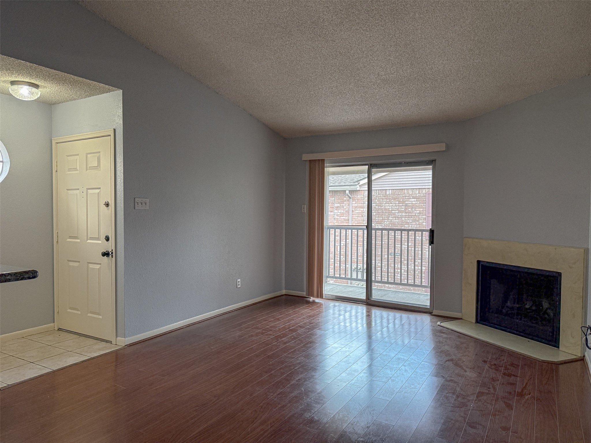 3100 Jeanetta Street, Unit 1104 Houston, TX 77063 - Photo 2 of 19 an empty room with wooden floor and windows
