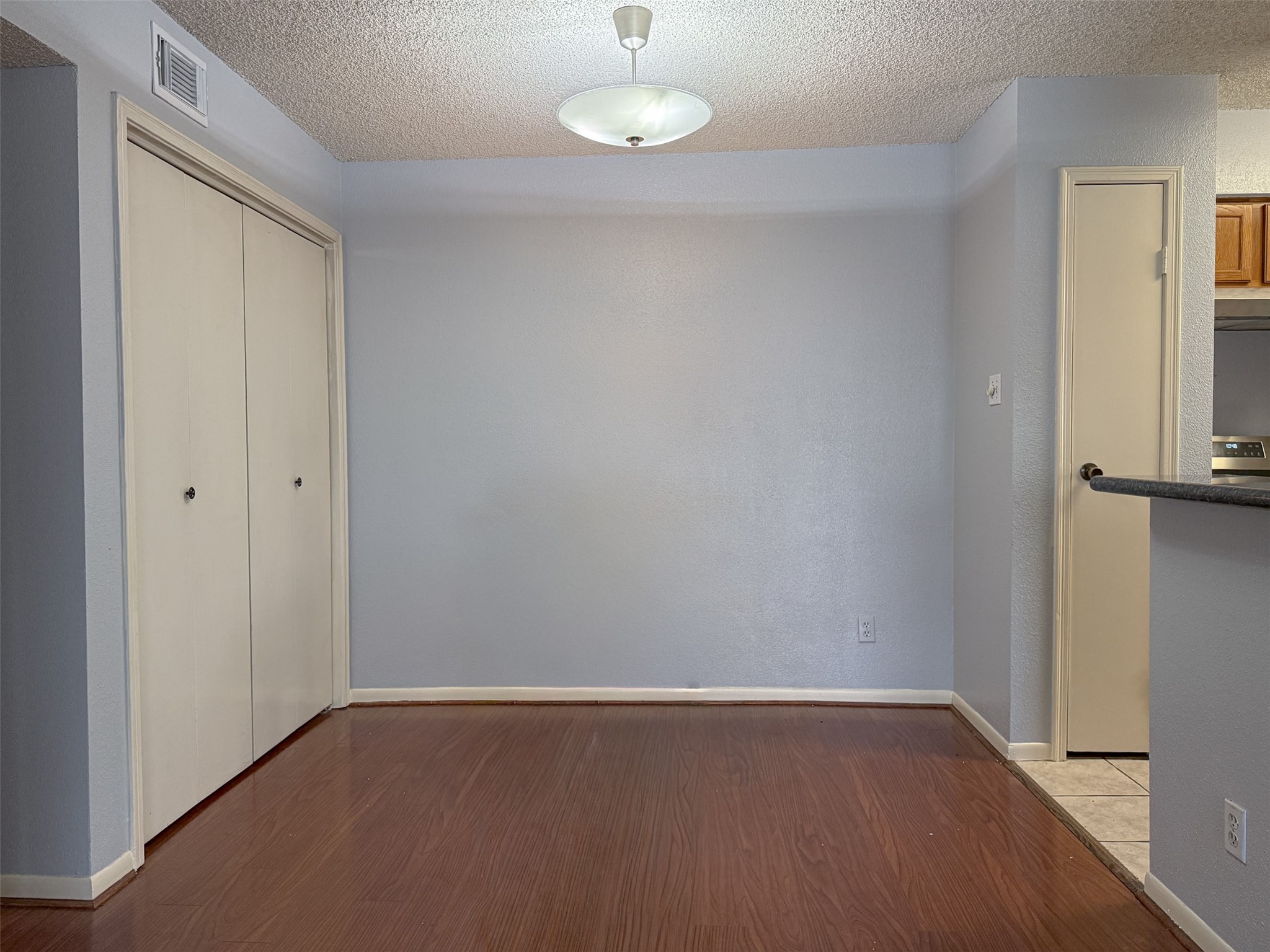 3100 Jeanetta Street, Unit 1104 Houston, TX 77063 - Photo 6 of 19 a view of an empty room with wooden floor and a window