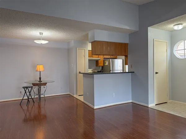 a view of a kitchen and dining room