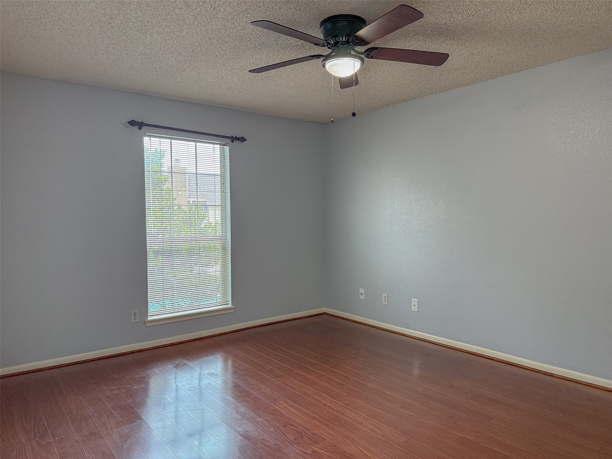 3100 Jeanetta Street, Unit 1104 Houston, TX 77063 - Photo 8 of 19 an empty room with wooden floor and windows