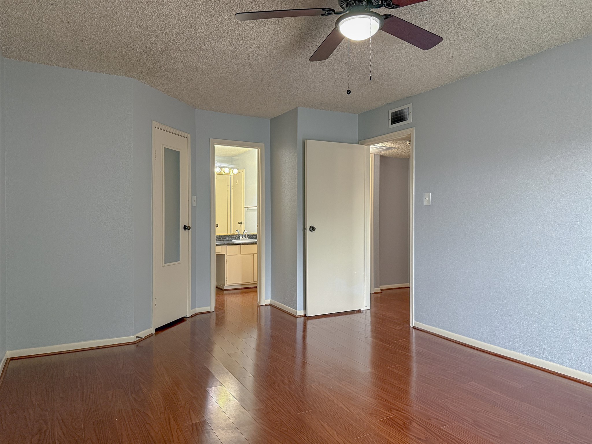 3100 Jeanetta Street, Unit 1104 Houston, TX 77063 - Photo 9 of 19 a view of an empty room and wooden floor