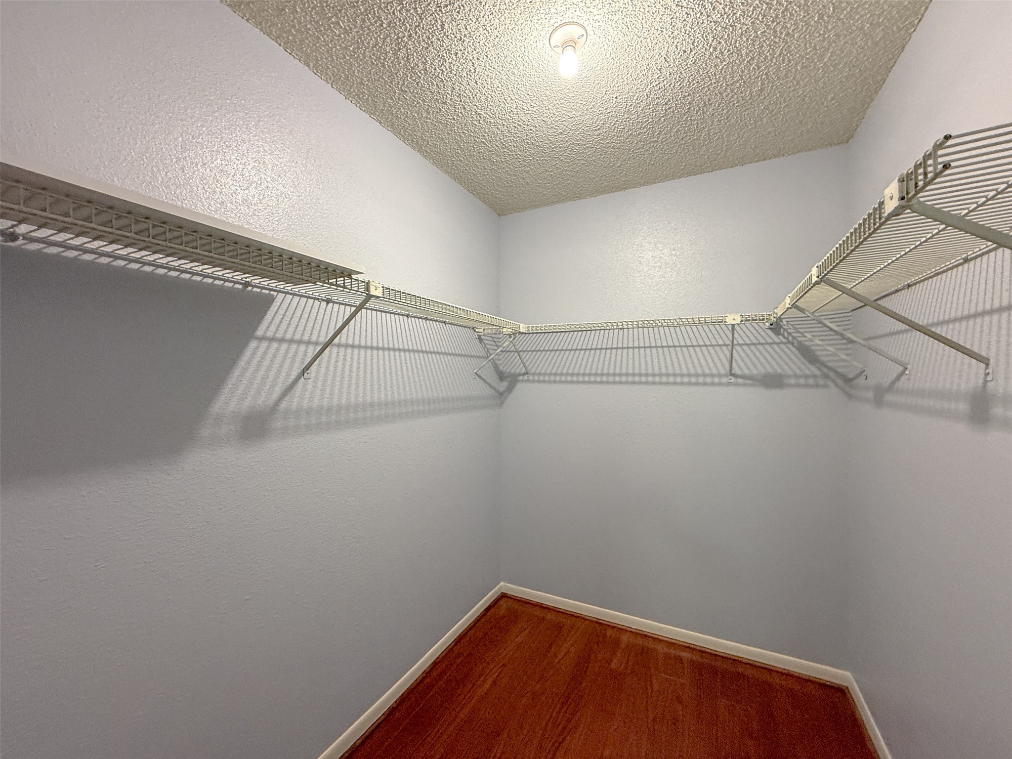 3100 Jeanetta Street, Unit 1104 Houston, TX 77063 - Photo 10 of 19 a view of a room with racks on the wall