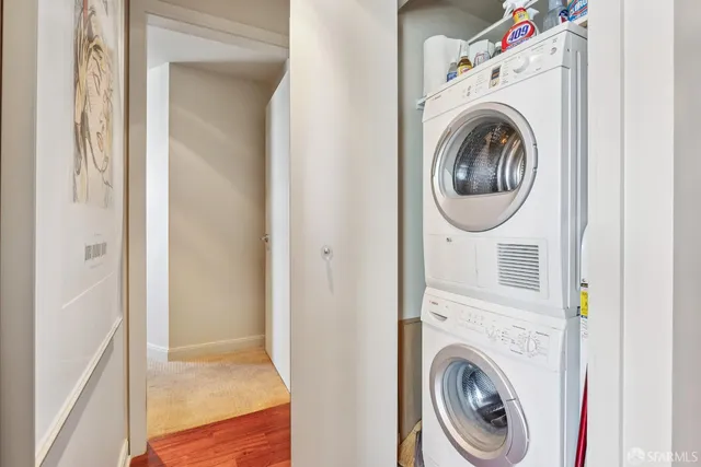 a view of a hallway with washer and dryer