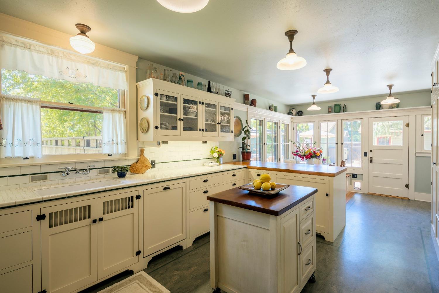 46 Pollasky Avenue Clovis, CA 93612 - Photo 18 of 69 a kitchen with stainless steel appliances granite countertop a sink stove and wooden floor